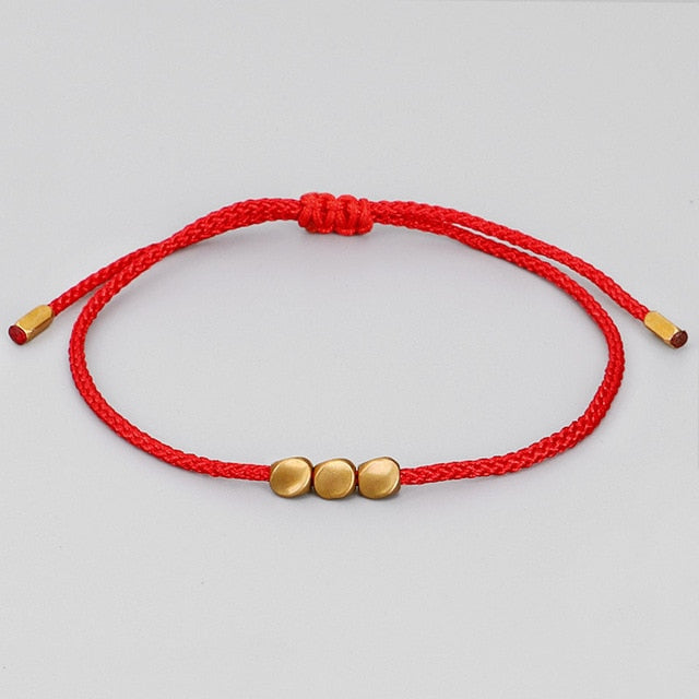 Red string bracelet buddhist top