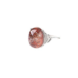 A ring with a silver framework, it is set with a natural rose quartz stone.