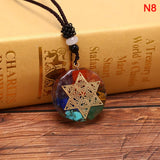 n8 orgonite pendant with the om symbol in 4 variants