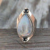 Natural Moonstone and Zinc Alloy Ring on Grey Background