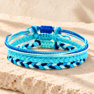 Blue Tibetan Buddhist bracelet arranged on natural limestone